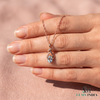 Oval Cut Aquamarine and Diamond Accent Twisted Swirl Pendant