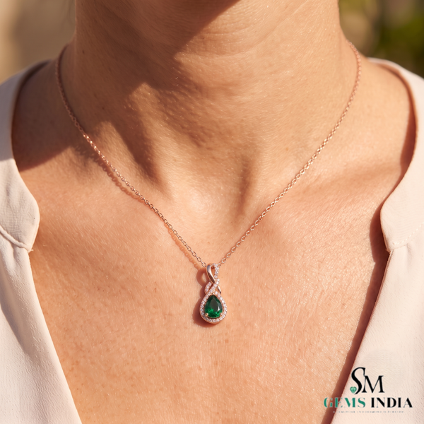 1.30 carat Infinity Teardrop Natural Emerald Pendant with Diamond Accents in 14K gold