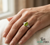 Elegant Oval Green Peridot Ring with Diamond Side Cluster