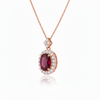 Oval Cut Ruby & Diamond Halo Pendant in 14K Gold