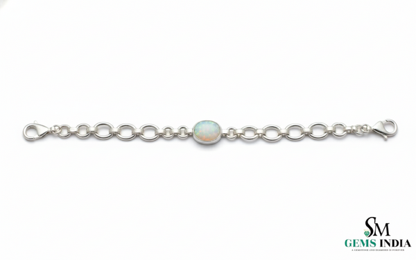 Doppelter Smaragd-Ring in offenem Design aus 14 Karat Gold – Band mit quadratisch und rund geschliffenen grünen Edelsteinen