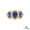 Oval Tanzanite & Diamond Halo Ring in 18k Gold – Luxury Three Stone Design
