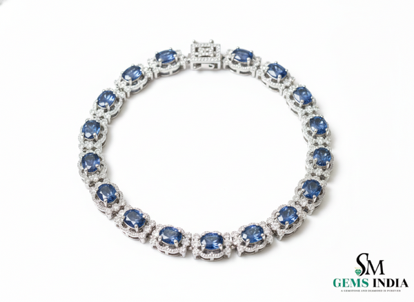 Tennisarmband aus Natur-Smaragden im Ovalschliff und Diamanten in Gold | Tennisarmband aus Natur-Smaragden und Diamanten in Gold | Tennisarmband mit großen Smaragden im Ovalschliff