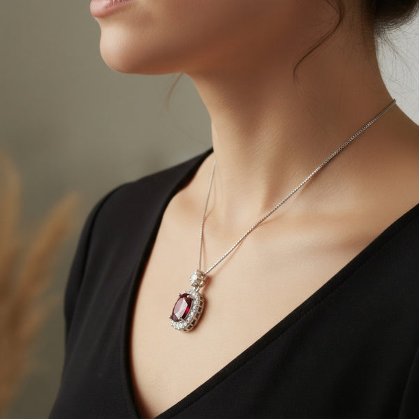 Oval Cut Ruby & Diamond Halo Pendant in 14K Gold