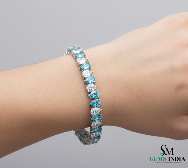 Tennisarmband aus Natur-Smaragden im Ovalschliff und Diamanten in Gold | Tennisarmband aus Natur-Smaragden und Diamanten in Gold | Tennisarmband mit großen Smaragden im Ovalschliff