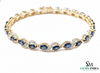 Tennisarmband aus Natur-Smaragden im Ovalschliff und Diamanten in Gold | Tennisarmband aus Natur-Smaragden und Diamanten in Gold | Tennisarmband mit großen Smaragden im Ovalschliff