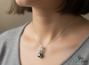 Round Faceted Emerald Solitaire Pendant with Diamond Loop - Green Gemstone Jewelry