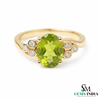 Elegant Oval Green Peridot Ring with Diamond Side Cluster
