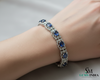 Tennisarmband aus Natur-Smaragden im Ovalschliff und Diamanten in Gold | Tennisarmband aus Natur-Smaragden und Diamanten in Gold | Tennisarmband mit großen Smaragden im Ovalschliff