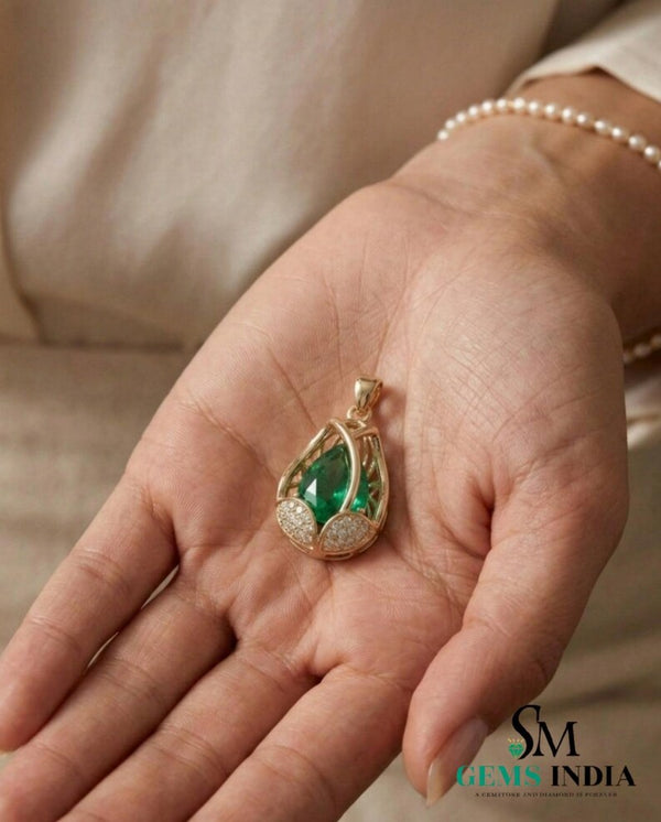Natural pear shape emerald and diamond pendant