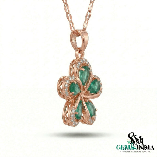 Pear Cut Emerald Flower Pendant with Diamond Halo in 18k Gold