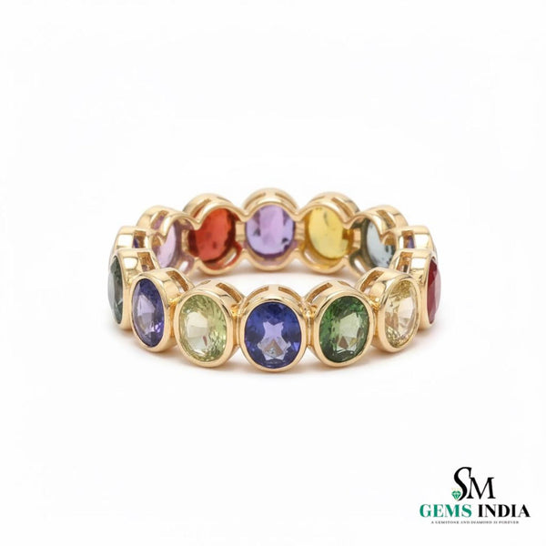 Doppelter Smaragd-Ring in offenem Design aus 14 Karat Gold – Band mit quadratisch und rund geschliffenen grünen Edelsteinen