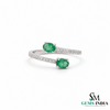 Elegant Oval Emerald and Diamond Bypass Ring - Green Gemstone Jewelry