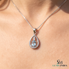 Natural Oval Cut Aquamarine Drop Pendant in a Diamond-Accented Tear Frame