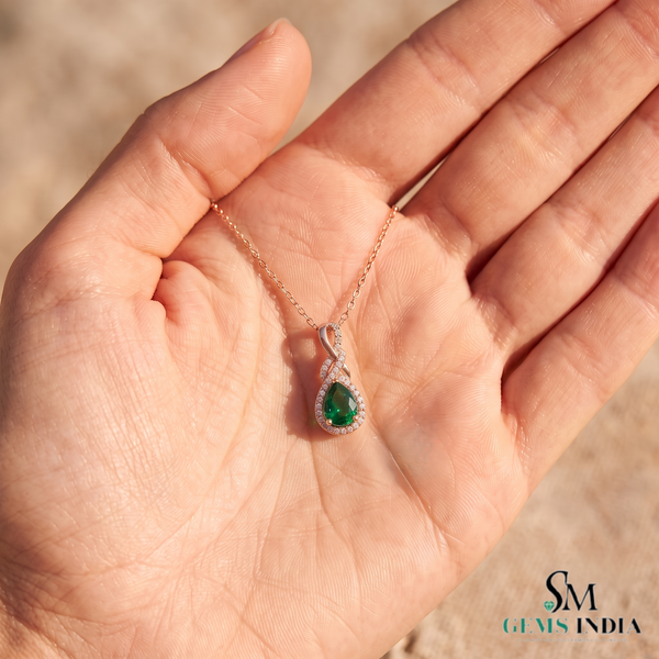 1.30 carat Infinity Teardrop Natural Emerald Pendant with Diamond Accents in 14K gold