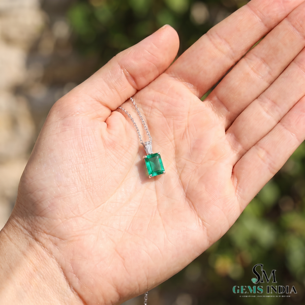 Elegant 1.03 carat Emerald cut Natural Emerald and Baguette Diamond Drop Pendant