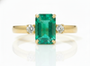 2.50 carat Elegant Emerald Cut Emerald Ring with Diamond Accents and 14k Gold Flat Band