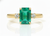 2.50 carat Elegant Emerald Cut Emerald Ring with Diamond Accents and 14k Gold Flat Band