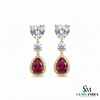 Pear Ruby Drop Earrings with Heart Moissanite & Diamond Accents in 18k Gold
