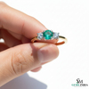 Minimalist Emerald Center Stone Ring with Diamond Accents