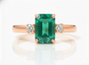 2.50 carat Elegant Emerald Cut Emerald Ring with Diamond Accents and 14k Gold Flat Band