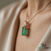 Emerald Cut Green Emerald Pendant with Round Diamond Accent