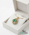 Natural pear shape emerald and diamond pendant