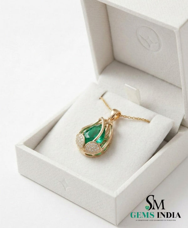 Natural pear shape emerald and diamond pendant