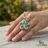 Pear Cut Emerald Flower Pendant with Diamond Halo in 18k Gold