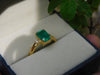2.50 carat Elegant Emerald Cut Emerald Ring with Diamond Accents and 14k Gold Flat Band