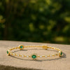 Tennisarmband aus Natur-Smaragden im Ovalschliff und Diamanten in Gold | Tennisarmband aus Natur-Smaragden und Diamanten in Gold | Tennisarmband mit großen Smaragden im Ovalschliff
