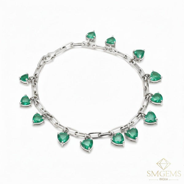 Tennisarmband aus Natur-Smaragden im Ovalschliff und Diamanten in Gold | Tennisarmband aus Natur-Smaragden und Diamanten in Gold | Tennisarmband mit großen Smaragden im Ovalschliff