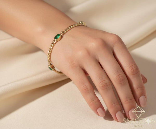 Tennisarmband aus Natur-Smaragden im Ovalschliff und Diamanten in Gold | Tennisarmband aus Natur-Smaragden und Diamanten in Gold | Tennisarmband mit großen Smaragden im Ovalschliff