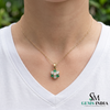 Round Emerald and Diamond Flower Pendant - Timeless Fine Jewelry