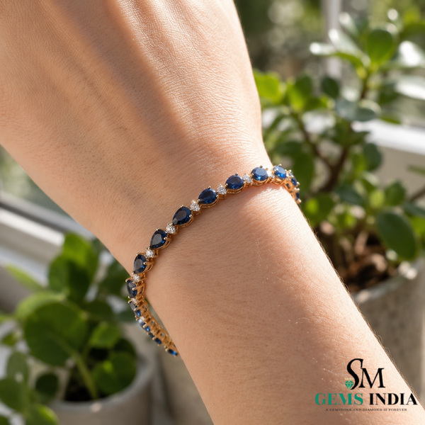 Pear-Cut Blue Sapphire Tennis Bracelet with Diamond Accents - September Birthstone Gift