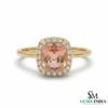 Gold ring with a pink gemstone and diamonds on a white background, branded 'SM Gems India'.