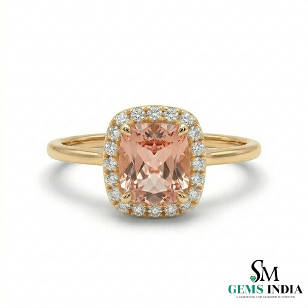 Gold ring with a pink gemstone and diamonds on a white background, branded 'SM Gems India'.