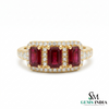 Three-stone emerald-cut ruby ring with diamond halo in yellow gold setting for wom