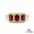 Three-stone emerald-cut ruby ring with diamond halo in yellow gold setting for wom