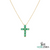Gold necklace with a green gemstone cross pendant on a white background, branded 'SM Gems India'.