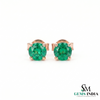 Round emerald stud earrings in rose gold setting, classic green gemstone jewelry for women