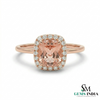Rose gold ring with a pink gemstone and diamonds on a white background, branded 'SM Gems India'.