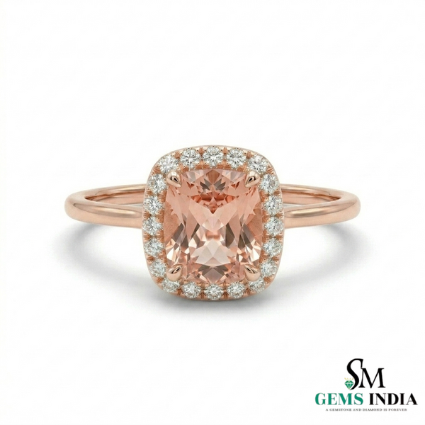 Rose gold ring with a pink gemstone and diamonds on a white background, branded 'SM Gems India'.