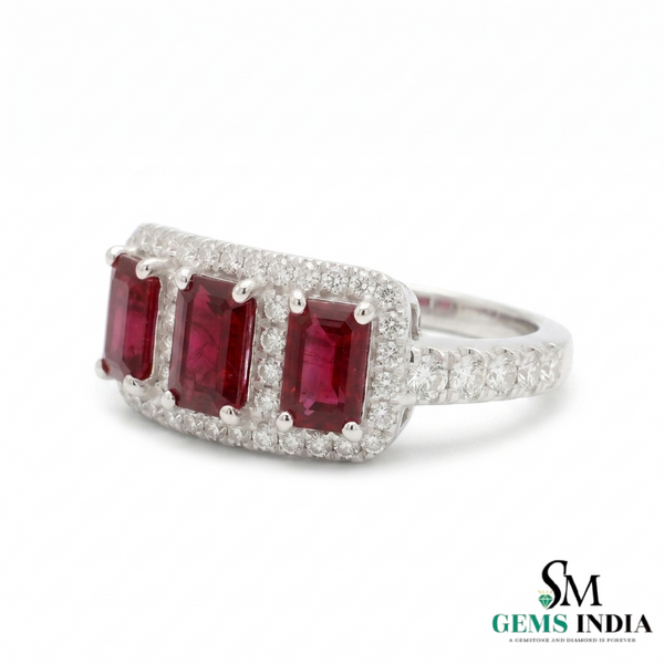 Ring with red gemstones and diamond accents on a white background, branded 'SM Gems India'.