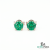 Green gemstone stud earrings on a white background with 'SM Gems India' logo.