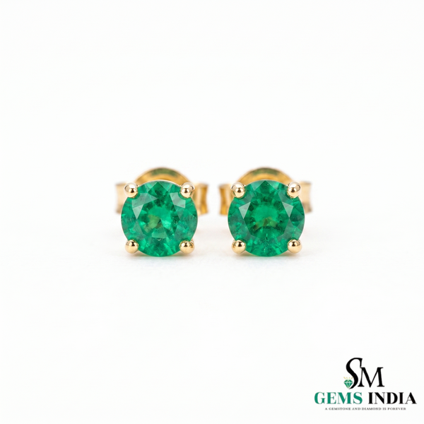 Gold earrings with green gemstones on a white background, branded 'SM Gems India'.