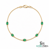 Tennisarmband aus Natur-Smaragden im Ovalschliff und Diamanten in Gold | Tennisarmband aus Natur-Smaragden und Diamanten in Gold | Tennisarmband mit großen Smaragden im Ovalschliff