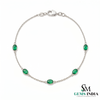 Tennisarmband aus Natur-Smaragden im Ovalschliff und Diamanten in Gold | Tennisarmband aus Natur-Smaragden und Diamanten in Gold | Tennisarmband mit großen Smaragden im Ovalschliff