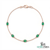 Tennisarmband aus Natur-Smaragden im Ovalschliff und Diamanten in Gold | Tennisarmband aus Natur-Smaragden und Diamanten in Gold | Tennisarmband mit großen Smaragden im Ovalschliff